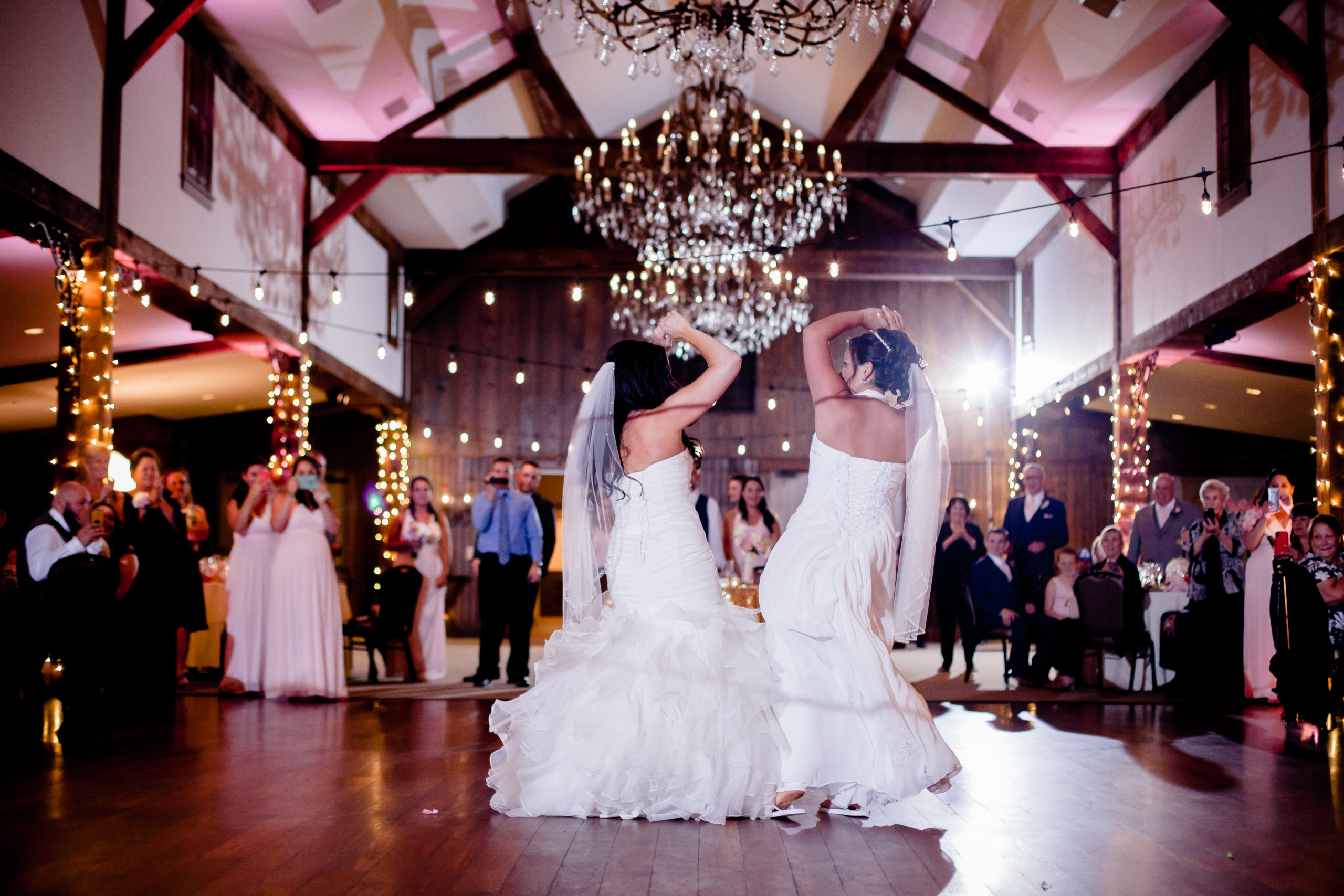bride and bridesmaid dancing
